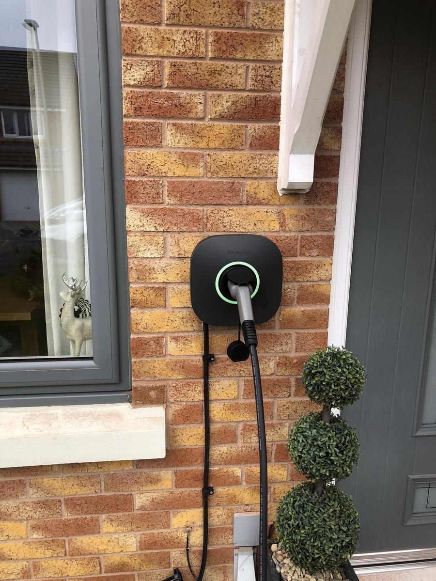 Smart home EV charger fitted beside a front door