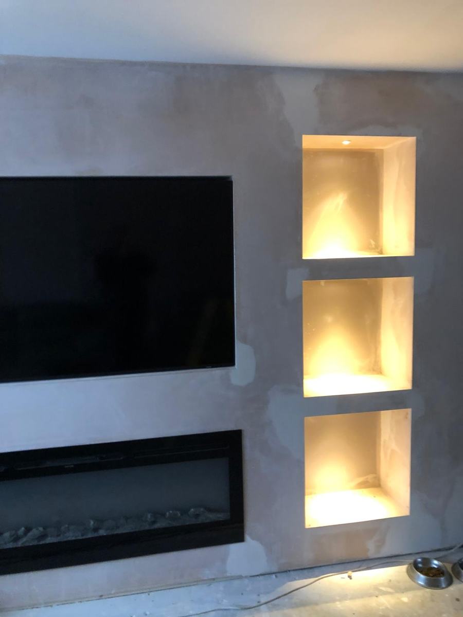 Media wall with lit alcoves